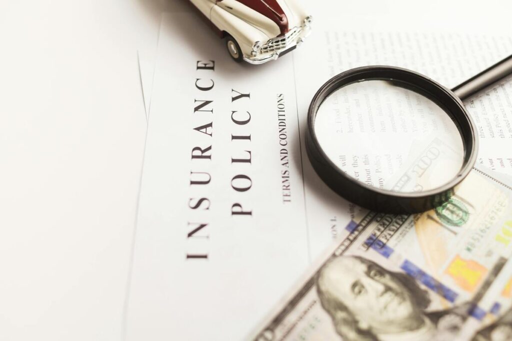 Insurance policy document with a magnifying glass