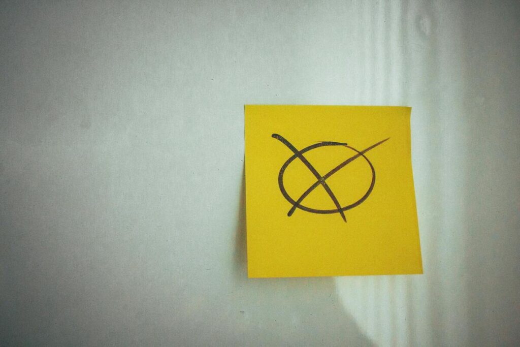 Yellow sticky note on the wall